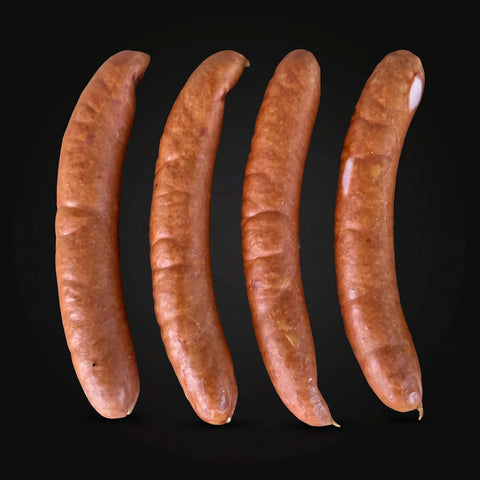 Vier Käsegriller nebeneinander auf dunklem Hintergrund